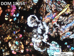 Thin Section Photo of Sample DOM 18054 in Cross-Polarized Light with 5X Magnification