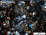 Thin Section Photo of Sample DOM 18441 in Cross-Polarized Light with 5X Magnification