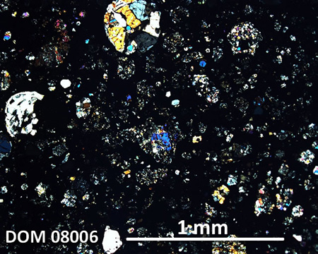 DOM 08006 Meteorite Thin Section Photo with 5x magnification in Cross-Polarized Light