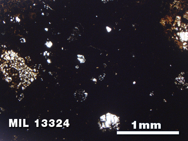 Thin Section Photo of Sample MIL 13324 in Plane-Polarized Light with 2.5X Magnification