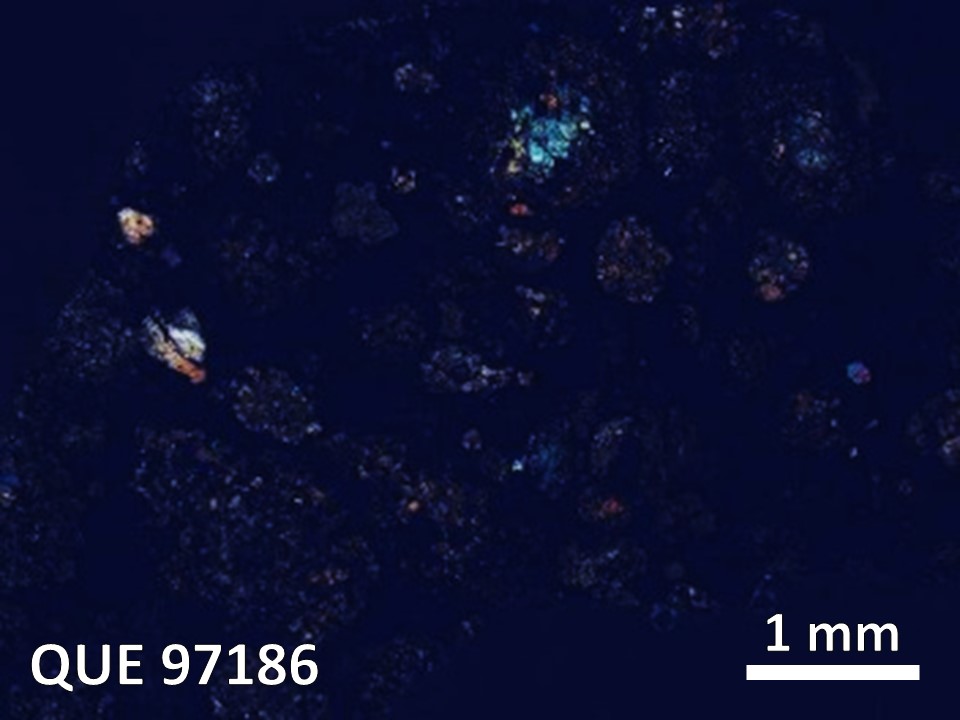 Thin Section Photo of Sample QUE 97186 in Cross-Polarized Light with  Magnification