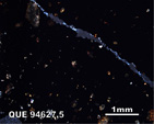 Thin Section Photo of Sample QUE 94627 in Cross-Polarized Light with 5X Magnification