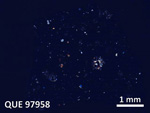 Thin Section Photo of Sample QUE 97958 in Cross-Polarized Light with 5X Magnification