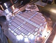 Stardust collection tray with blocks of silica aerogel being loaded